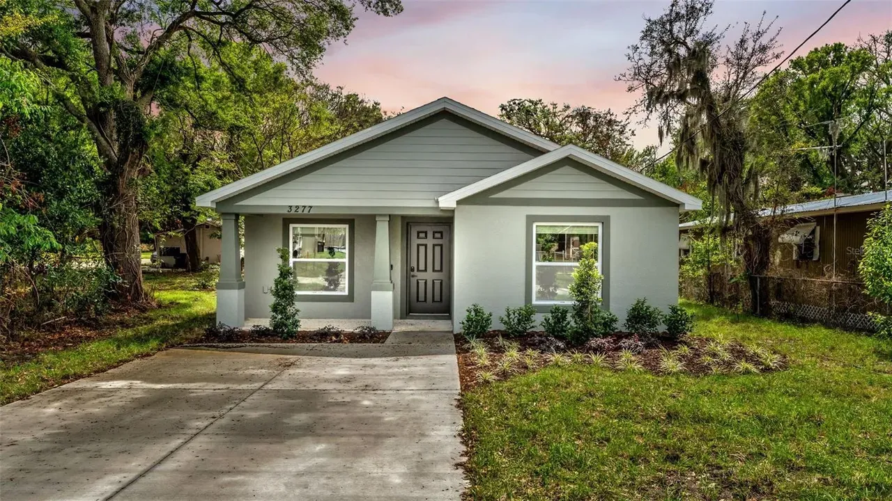 Front of a new construction home with covered porch in Bartow, FL
