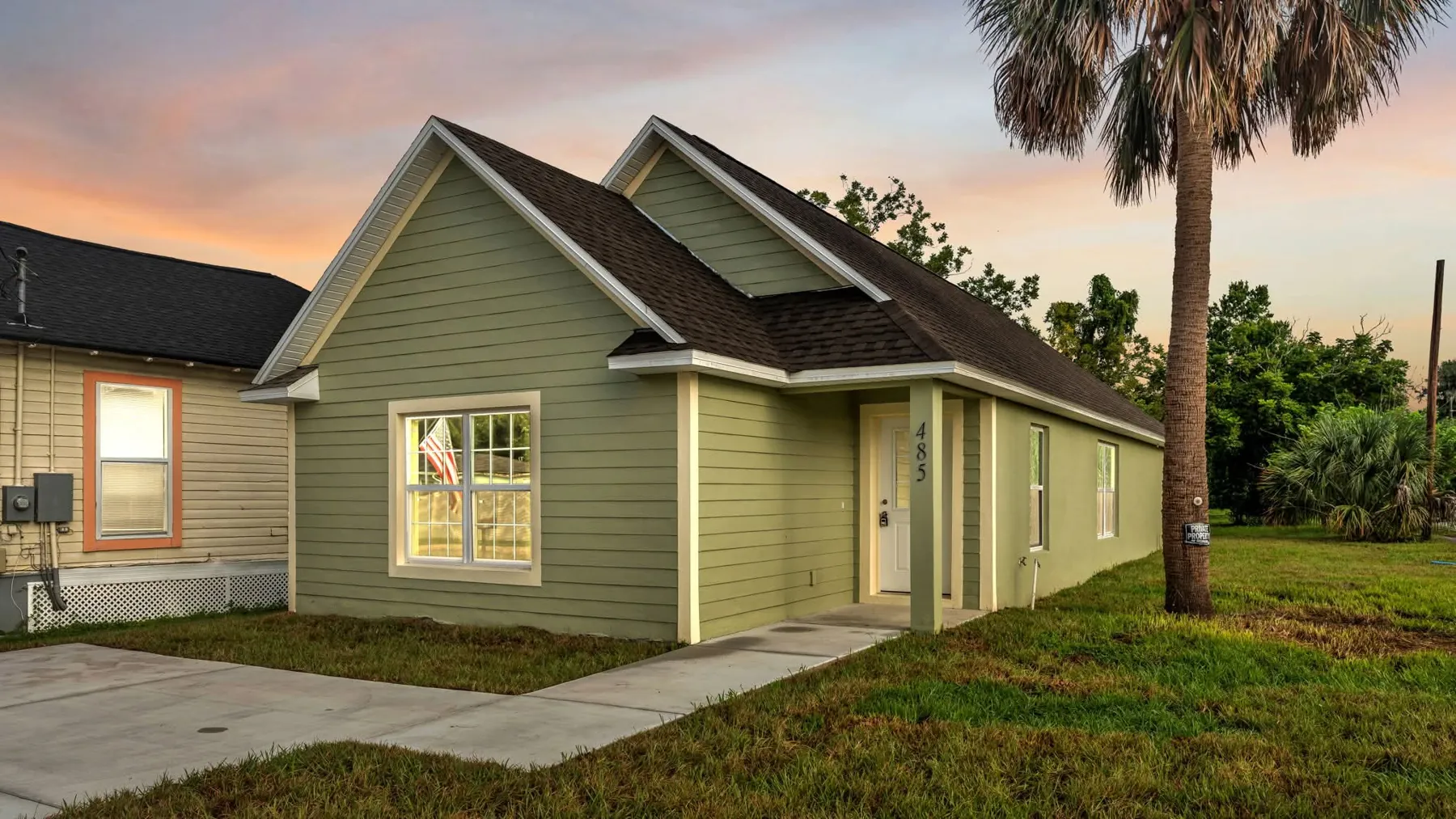 New construction rental home with lap siding at dusk in Bartow, FL